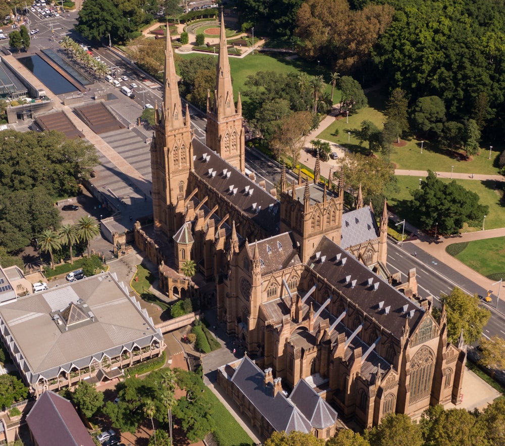 an aerial view of a cathedral in a city