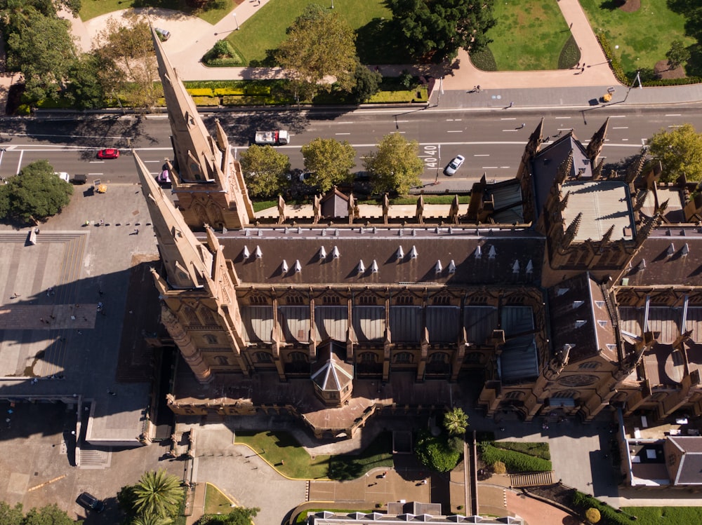 an aerial view of a large building with a clock tower