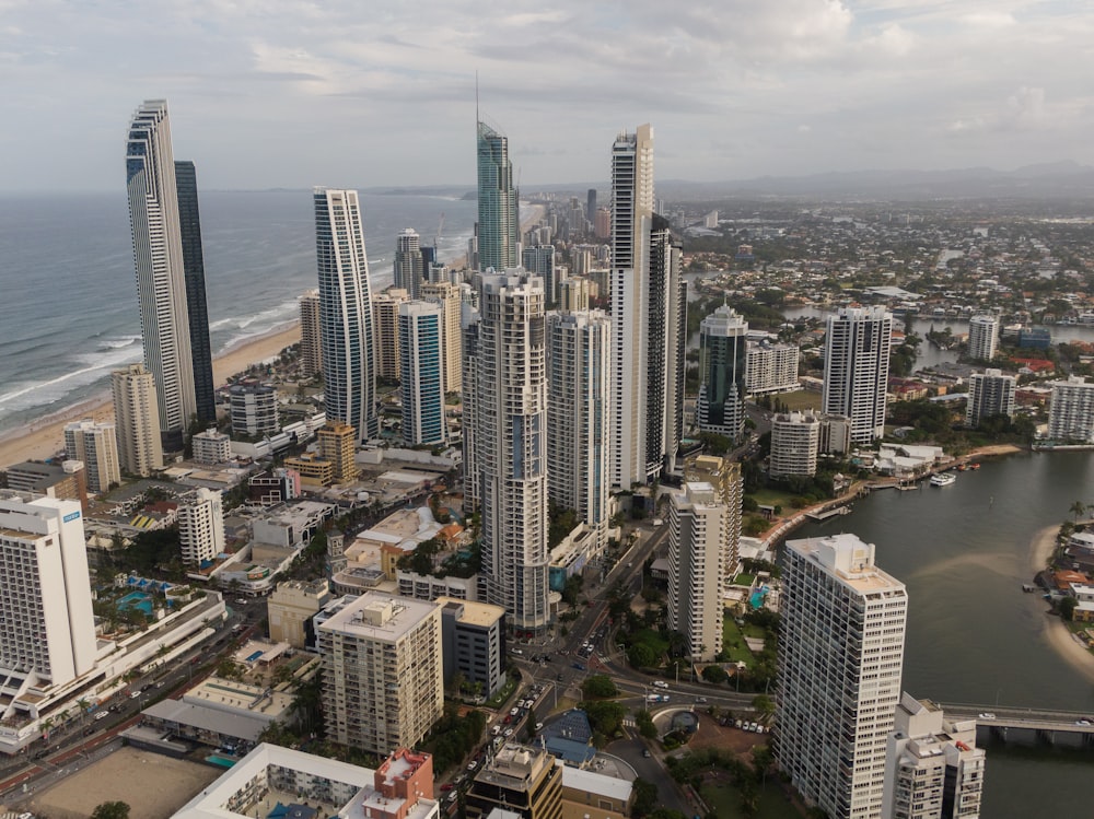 an aerial view of a city by the ocean