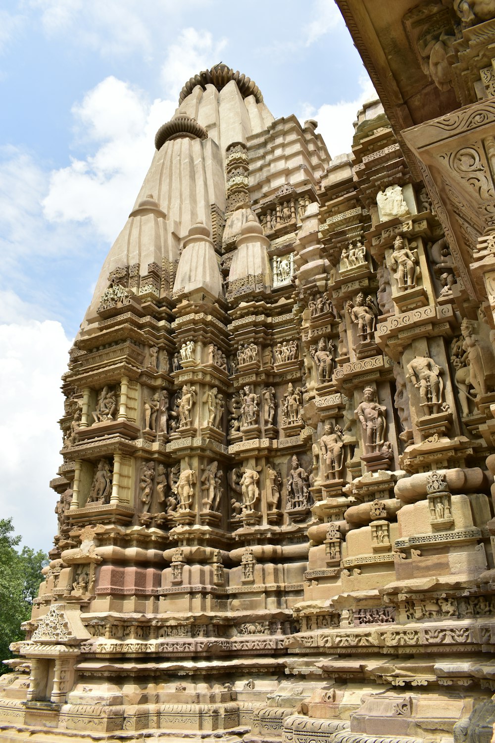 a large stone structure with statues on it