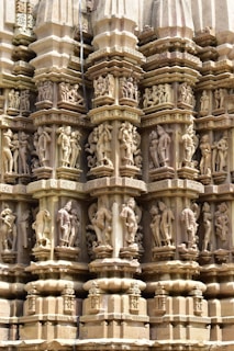a close up of a building with statues on it