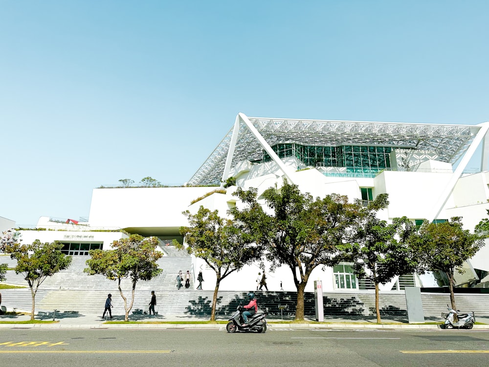 a motorcycle parked in front of a white building