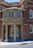 An entrance to a brick building with a rounded portico labeled 'Children's Court'. The structure features tall columns and an arched doorway with glass panes. A sign reading 'Albion St' is visible, along with a wheelchair accessibility symbol.