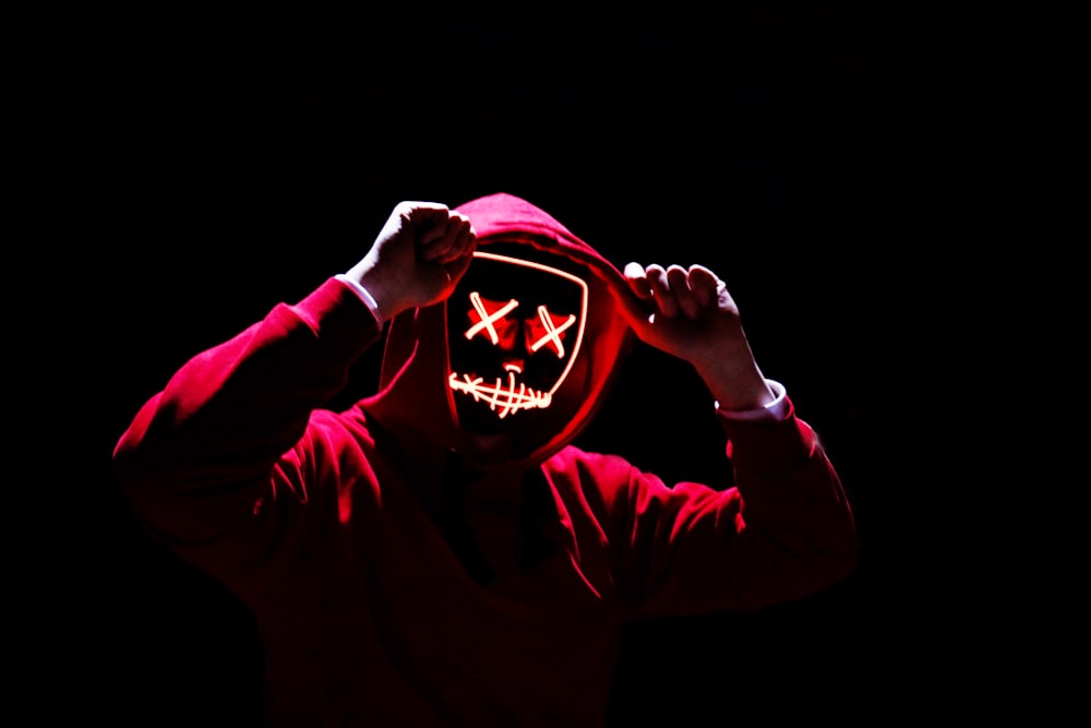 a person wearing a mask with a creepy face