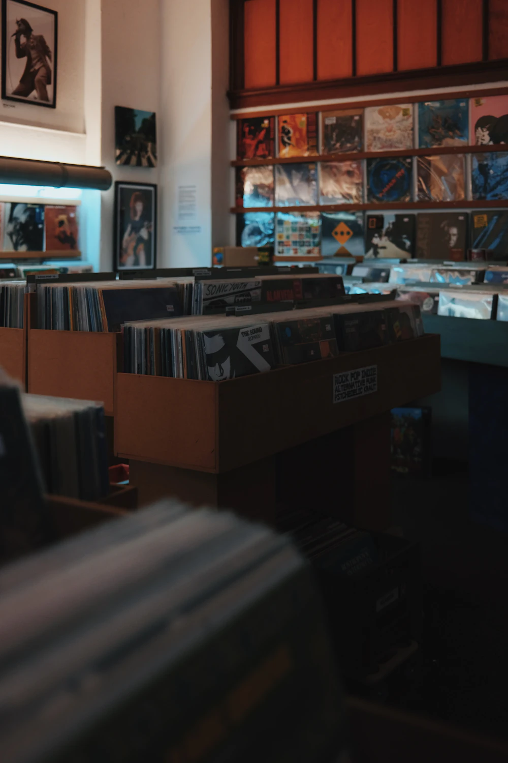 A room filled with shelves of records and CDs