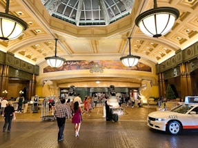 a couple of people that are walking in a building