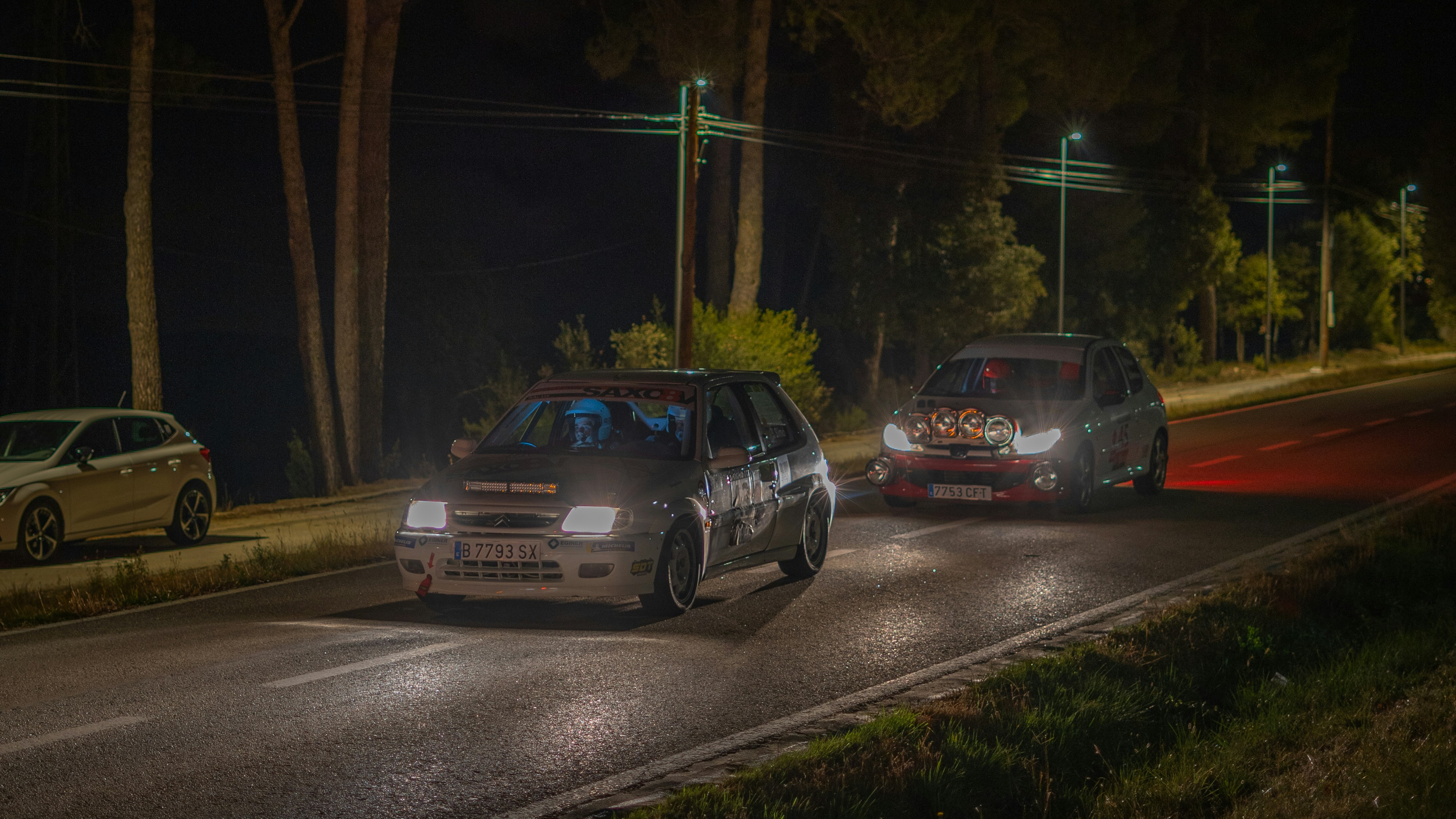 a couple of cars that are sitting in the street