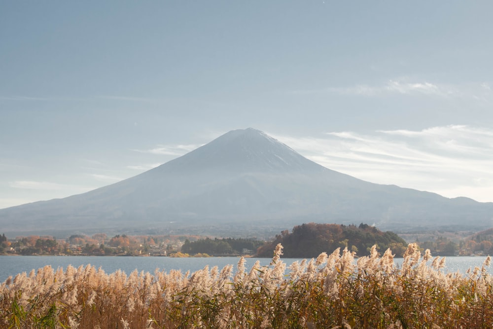 a view of a mountain with a lake in the foreground