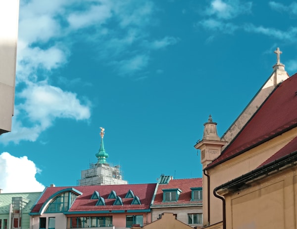 A vibrant collage of diverse church buildings from different continents under a bright sky.