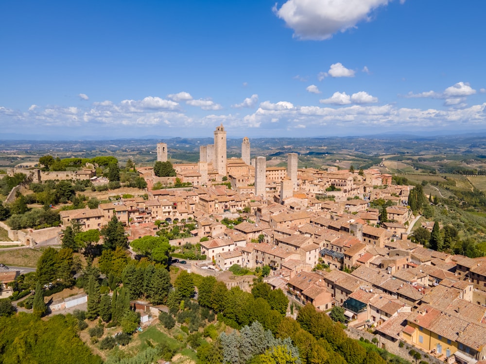 an aerial view of a city with tall buildings