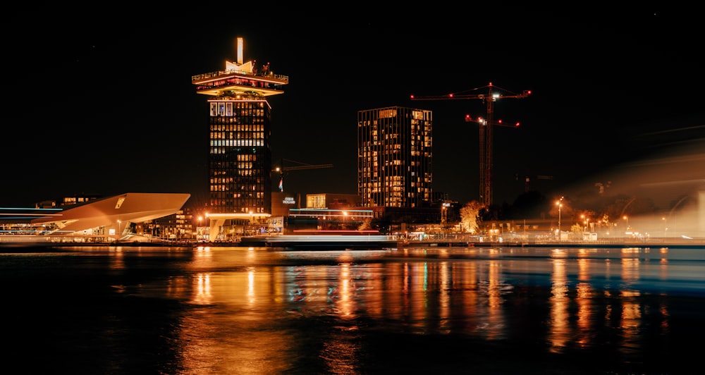 a large body of water with a city in the background