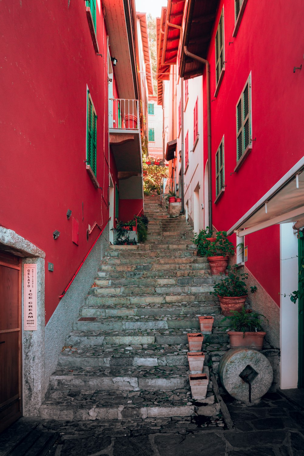 a set of steps leading up to a red building