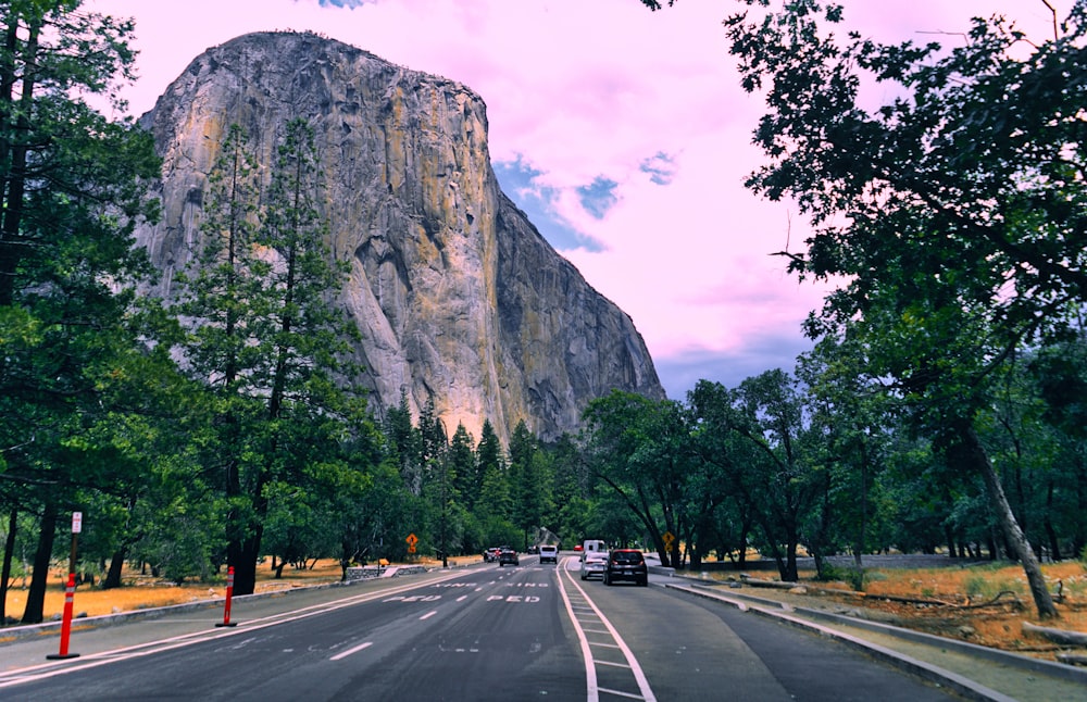 a road with a mountain in the background