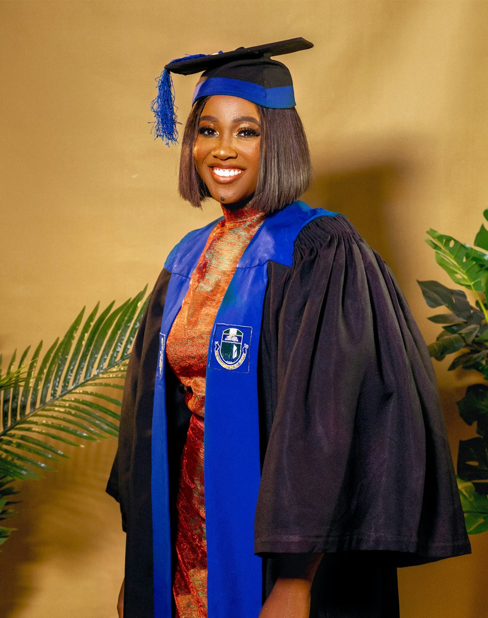 a woman in a graduation gown and cap