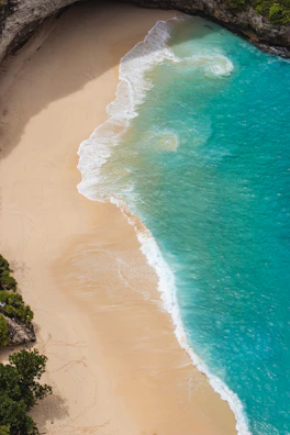 Aerial view of a pristine sandy beach surrounded by turquoise waters in the Archipiélago San Bernardo