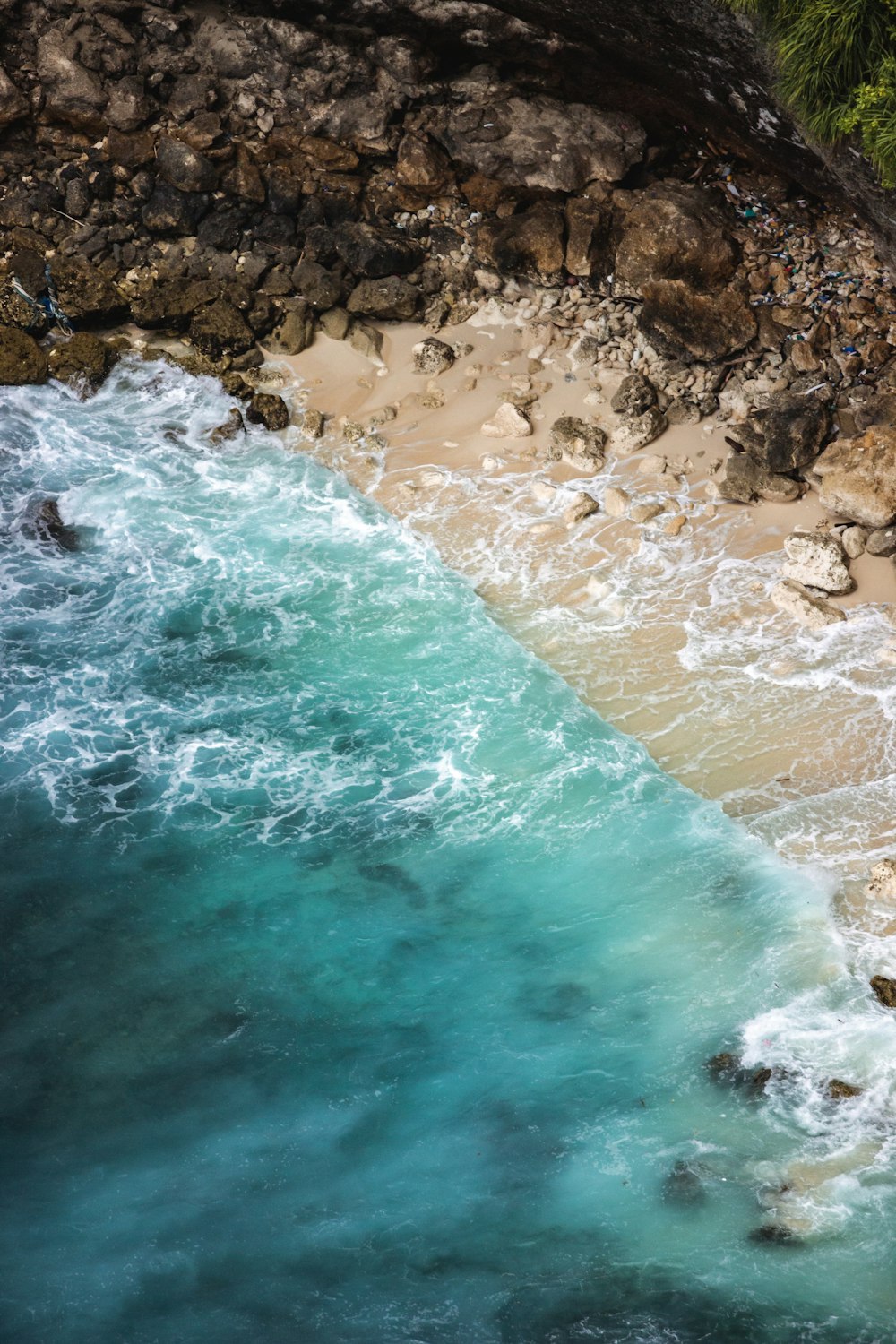 an aerial view of a beach and a body of water