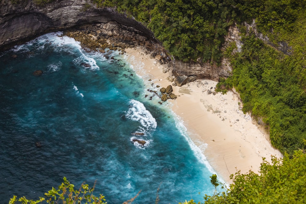 an aerial view of a sandy beach and ocean