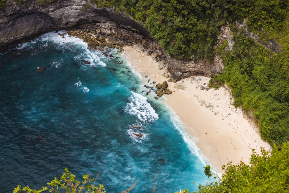 an aerial view of a sandy beach and ocean