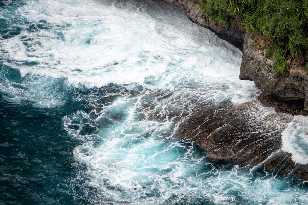 a large body of water next to a cliff