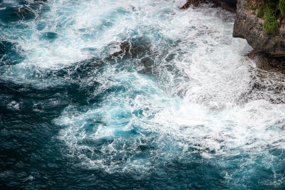 a large body of water next to a cliff