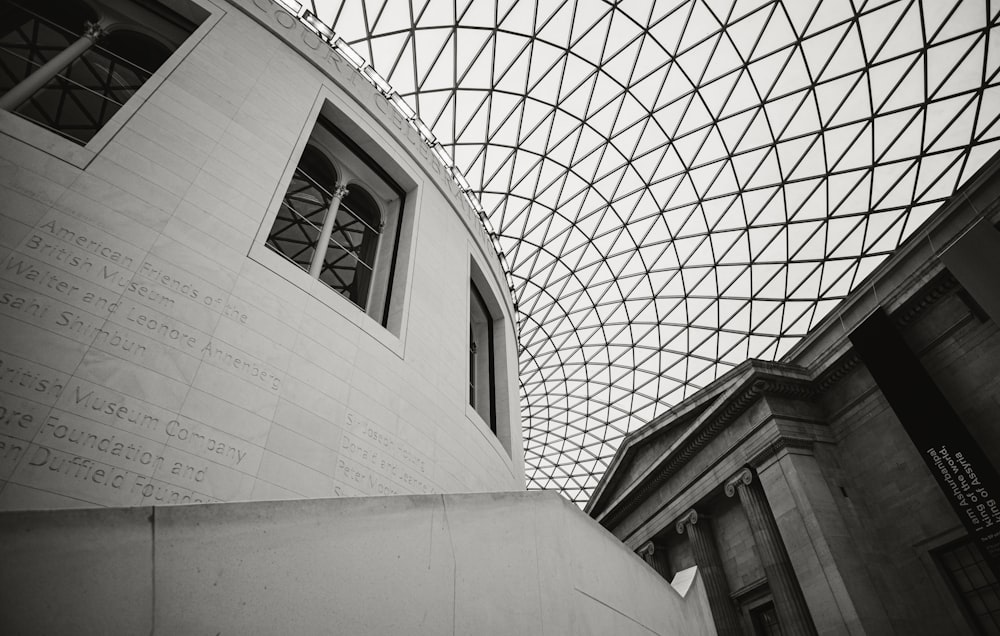 a building with a glass roof and writing on it