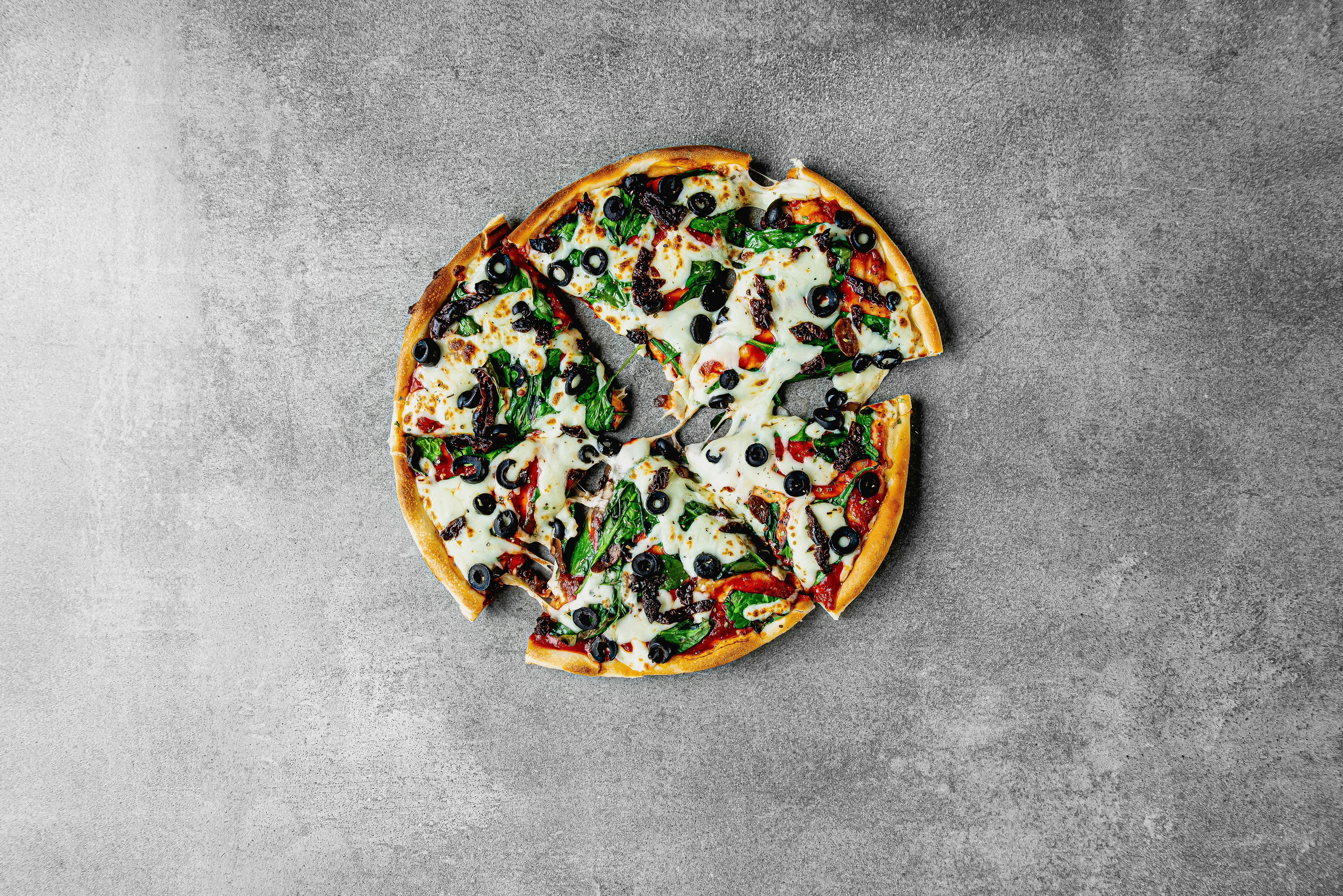 A pizza with a slice missing from it photo Free Pizza Image on Unsplash