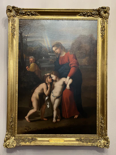 A gentle illustration of Jesus sitting with children in a peaceful garden.