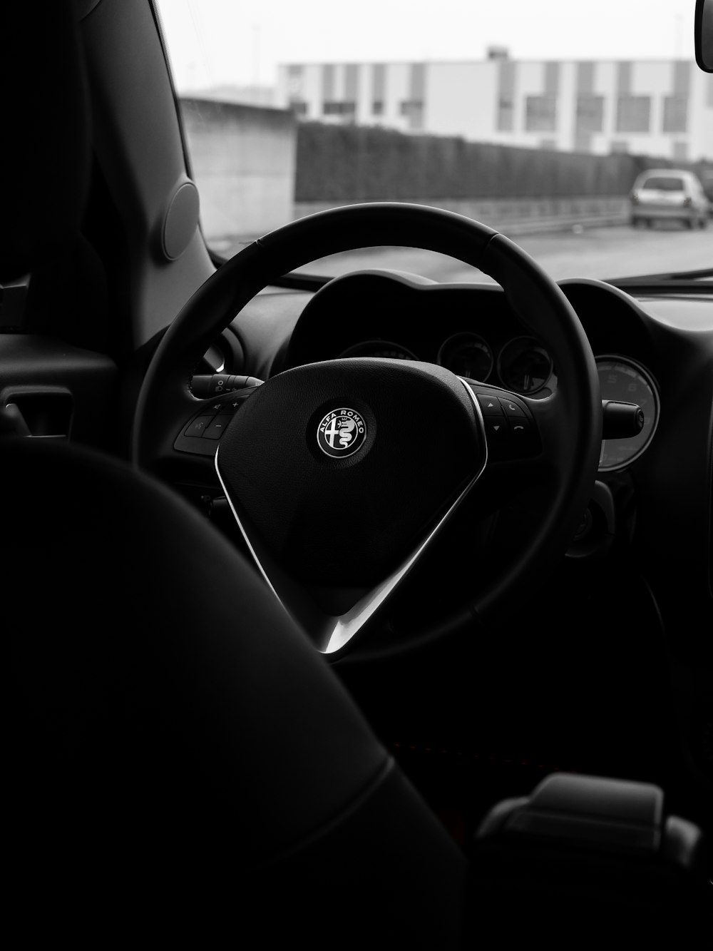 a black and white photo of a car dashboard