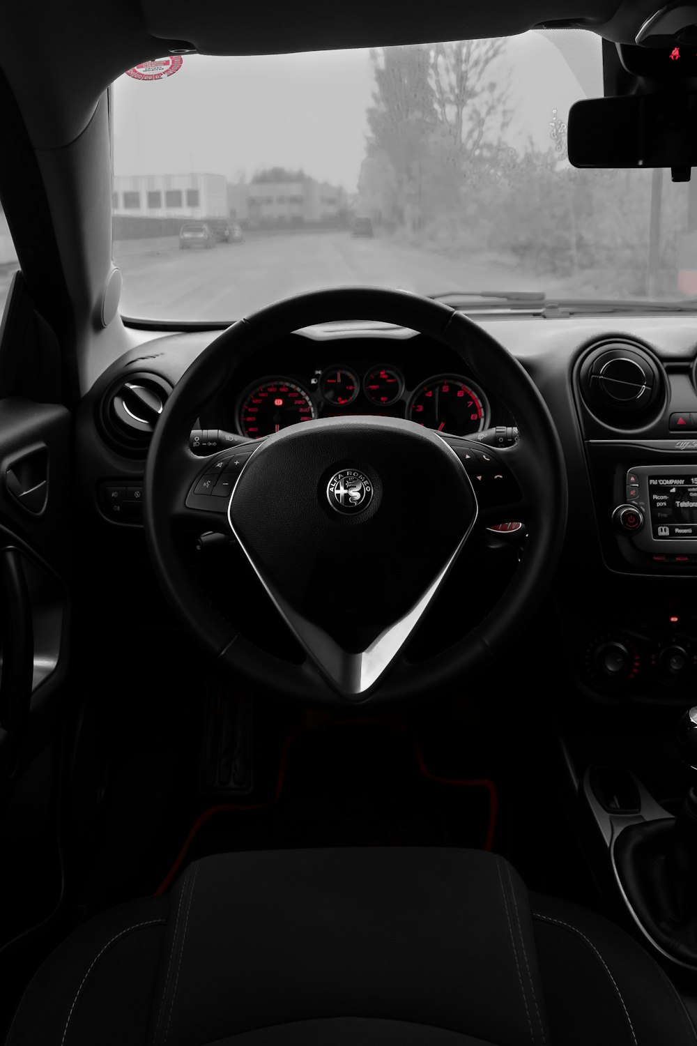 the dashboard of a car with a steering wheel and dashboard lights