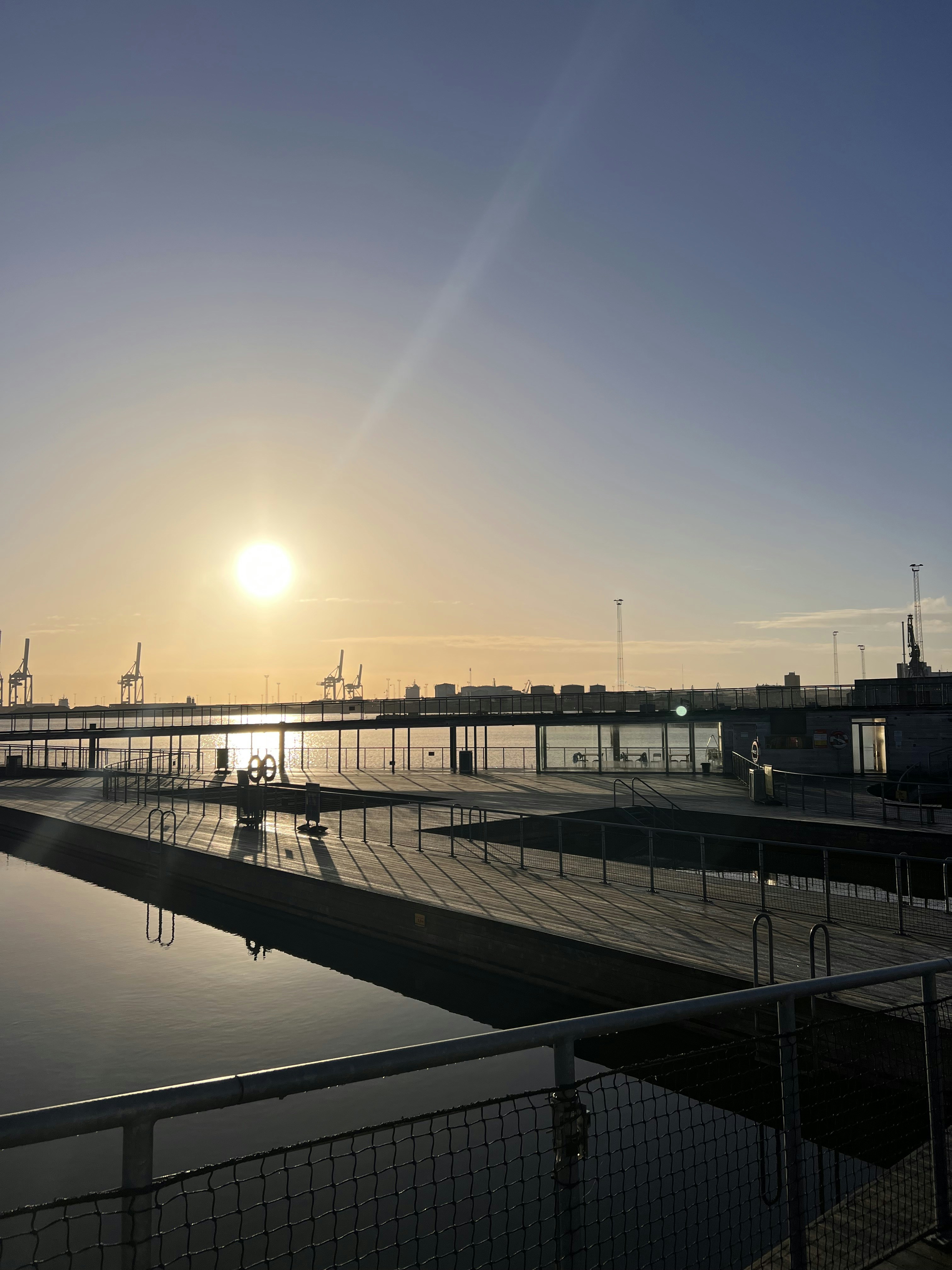 A picturesque view of Malmö's waterfront at sunset