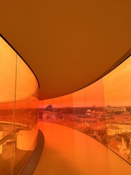 Glass balcony enclosure with a clear view of the city.