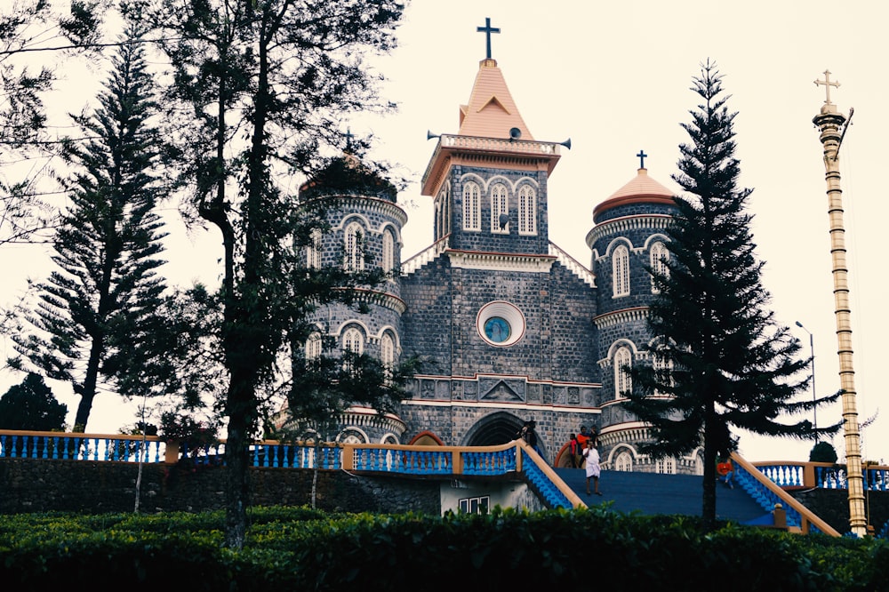 a church with a steeple and a steeple with a cross on it