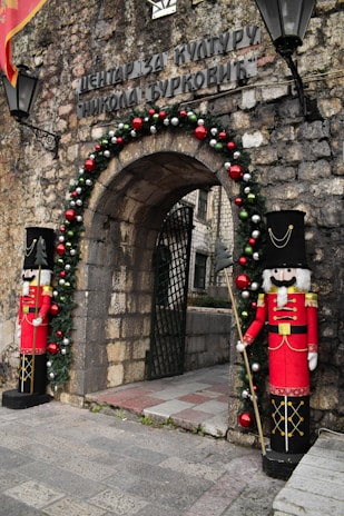 a couple of soldiers standing in front of a building