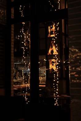 Evening view of the domaine with warm lights glowing from the private bar.