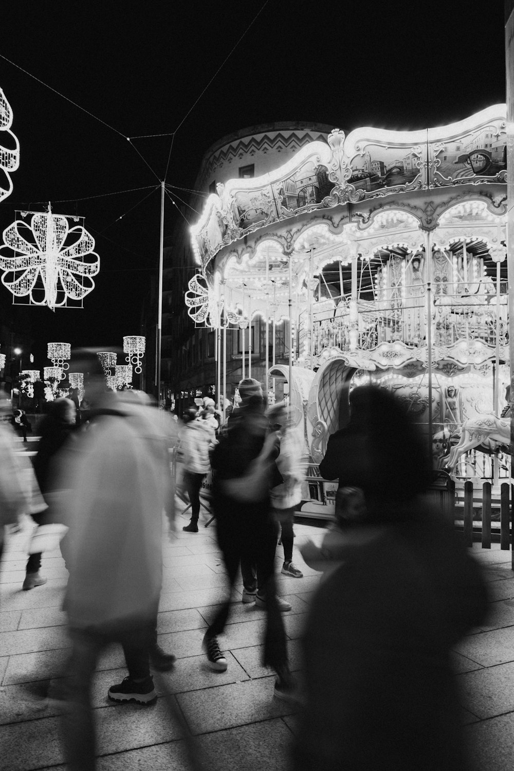 a black and white photo of a merry go round