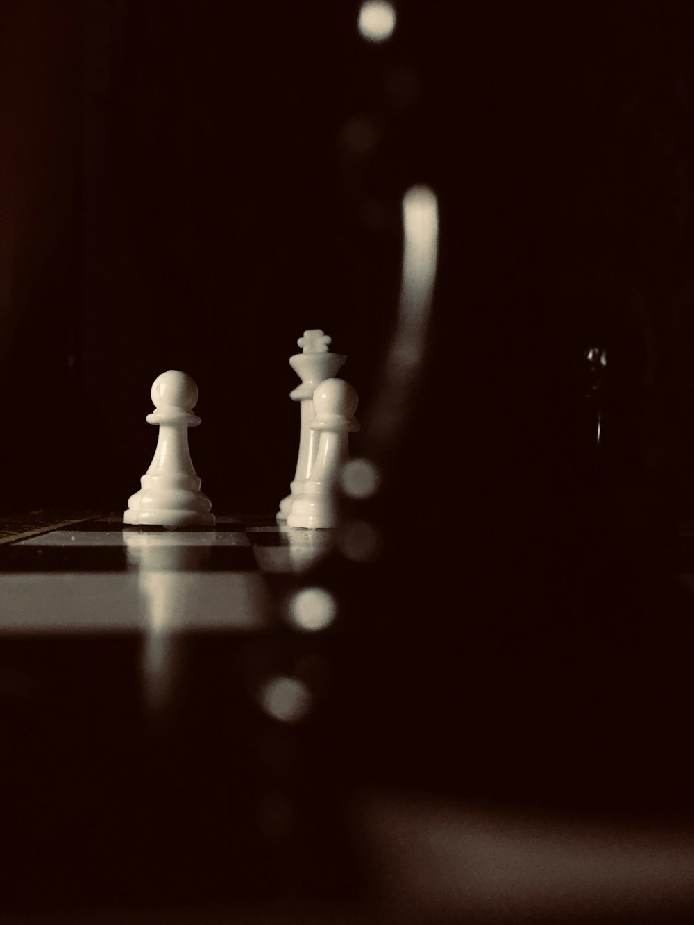 a black and white photo of a chess board