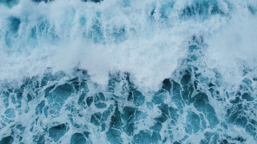 an aerial view of the ocean waves