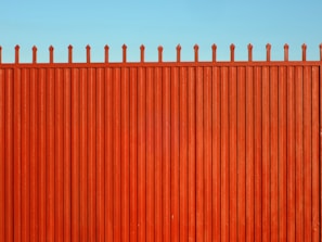 A sturdy, newly installed fence with clean lines and a smooth finish