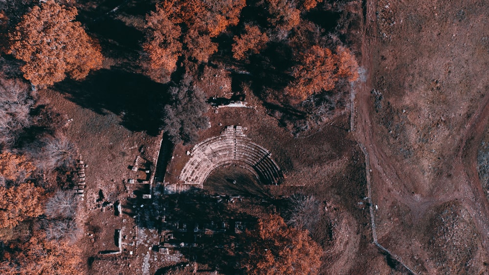 an aerial view of a building surrounded by trees