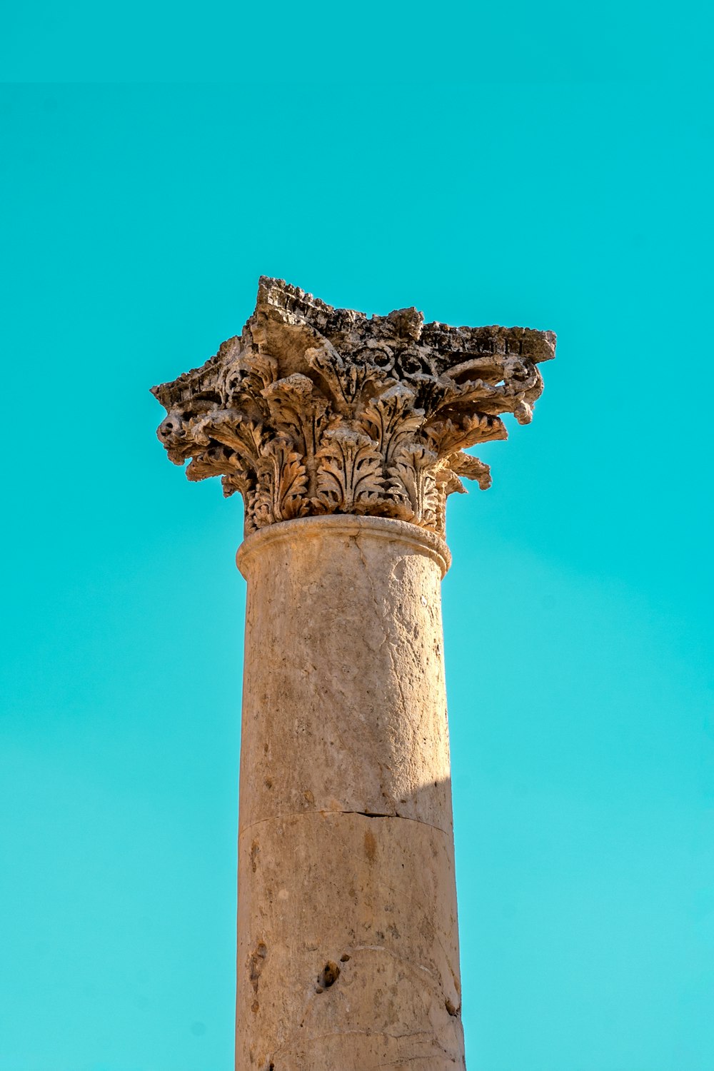 a close up of a pillar with a sky background