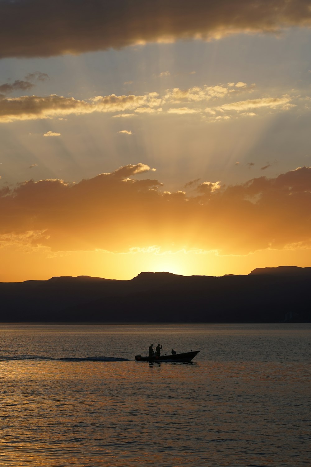 a couple of people on a boat in the water