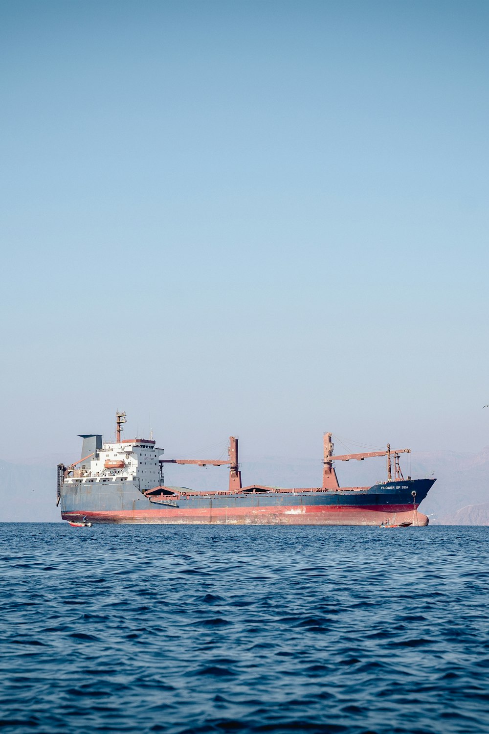 a large boat floating on top of a large body of water