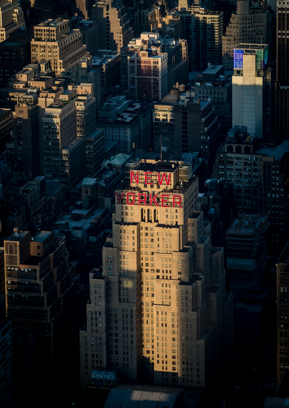 a very tall building with a sign on top of it