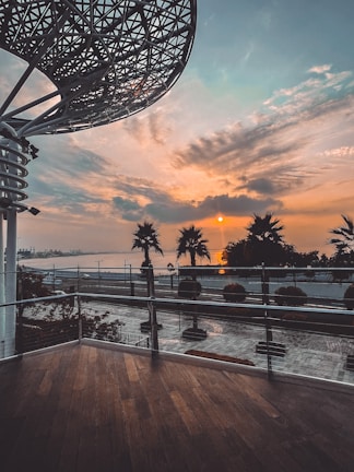 Sunset over a modern beachfront property in Playa del Carmen, highlighting architectural details.