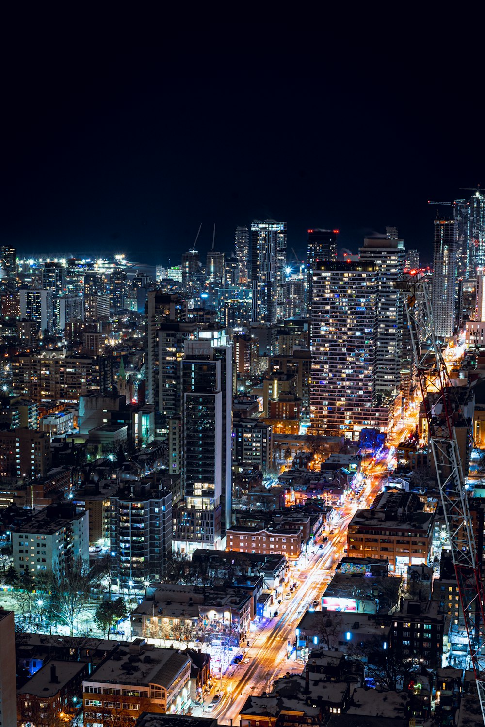 a view of a city at night from the top of a building