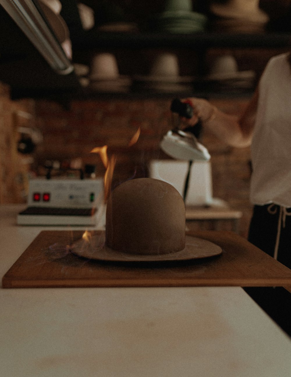 a person standing in a kitchen preparing food