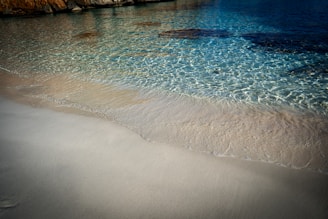A beautiful beach with clear blue water.