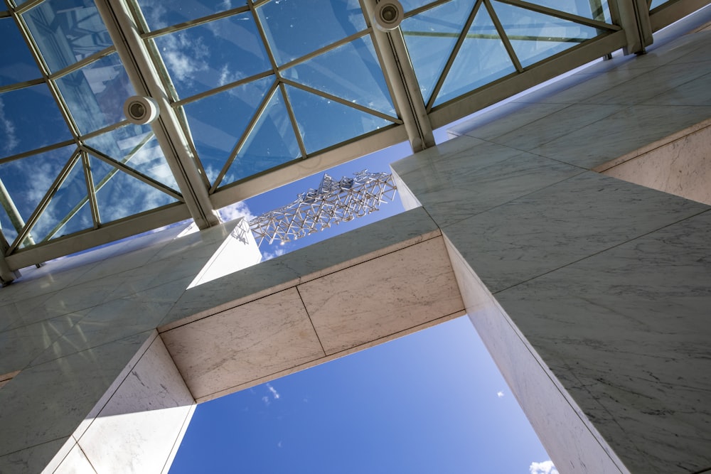 looking up at the sky from the ground level of a building