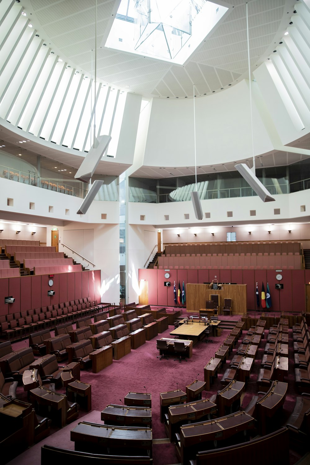 a large room filled with lots of wooden chairs