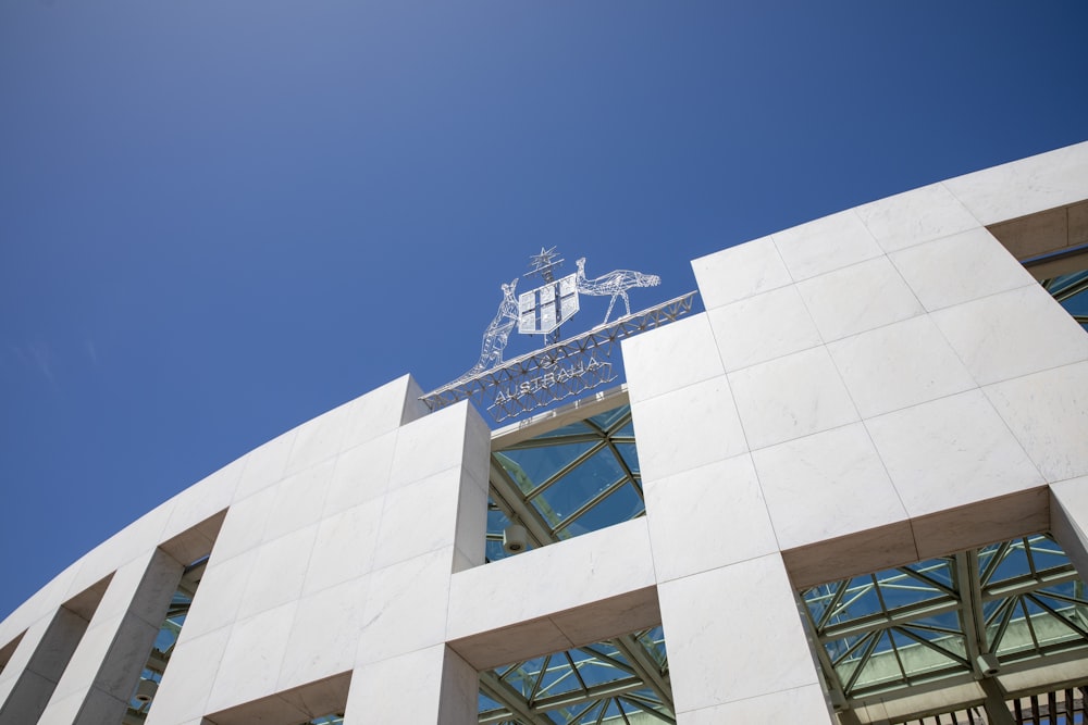 a white building with a blue sky in the background